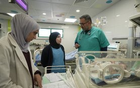 Dr. Ahmad Al-Farra (right) meets with nurses in the Nasser Medical Complex in Khan Younis, southern Gaza.